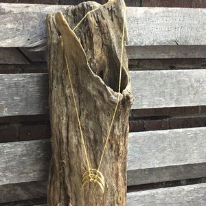 Gold tone dangle necklace